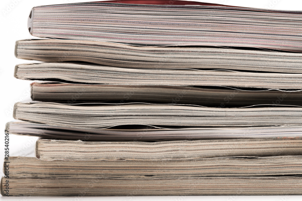 selective focus of the stacking magazine place on white background