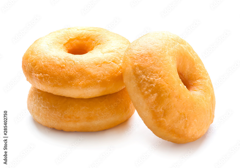 Sweet tasty donuts on white background