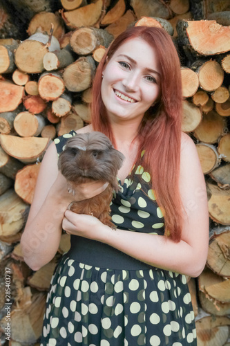 caucasian girl with her friend Guinea Pig together