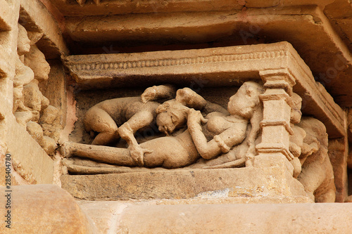 Close up of Kamasutra Pose/scenes on the wall of Hindu temple in Western Group of Temple Khajuraho, Madhya Pradesh