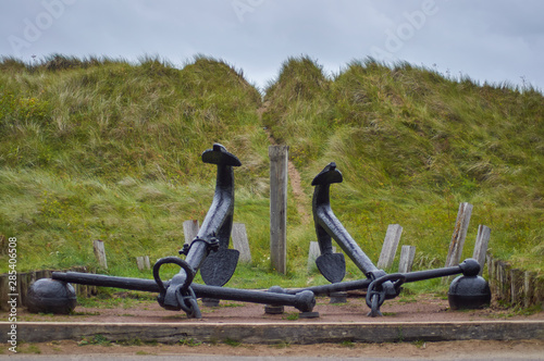 A Brace of heavy or bower Anchors set as a Visitor Attraction at the entrance to the beach of Cefn Sidan on a windy Summers day, Wales