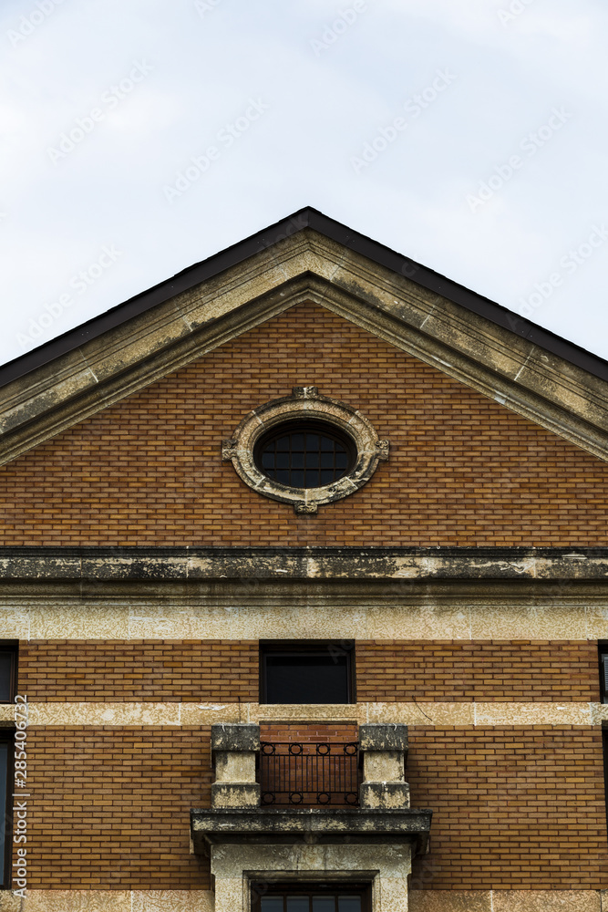 Front view symmetrical old brick building