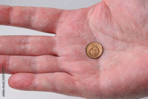 old russian one kopek  coin isolated  in the hand sickle and hammer side