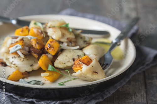 Ravioli, pelmeni, dumplings, pierogi, with pumpkin and fried onions