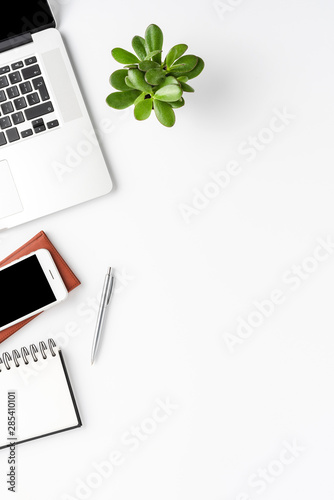 Business background with laptop and accessories. Office desktop. Top view
