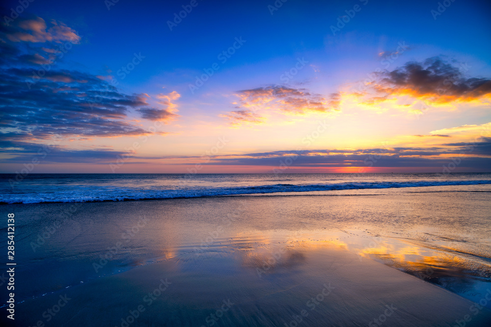 Magic Dramatic Unreal Sunset in Seminyak beach, Bali, Indonesia