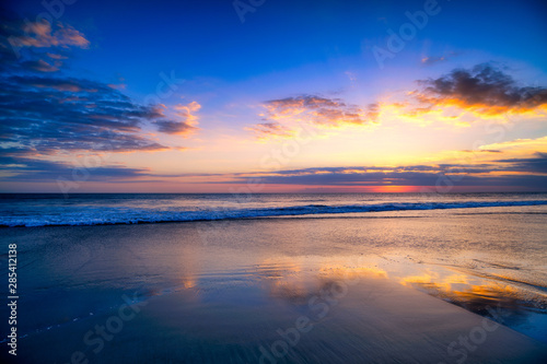 Magic Dramatic Unreal Sunset in Seminyak beach  Bali  Indonesia
