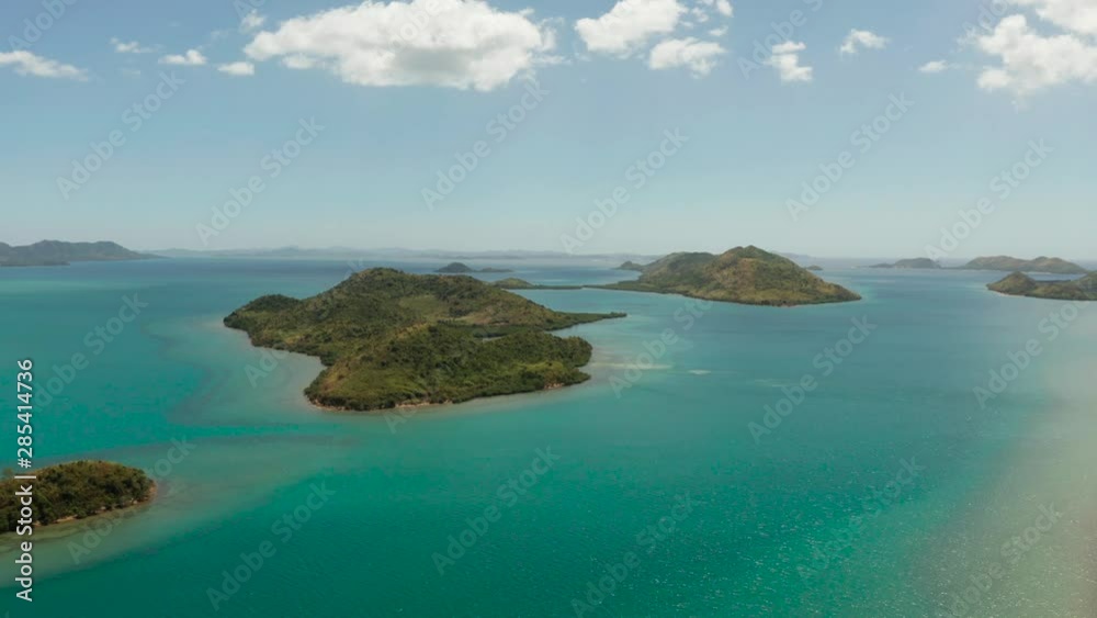 Aerial drone small island group in province of Palawan. Busuanga, Philippines. Seascape, islands covered with forest, sea with blue water. tropical landscape, travel concept Aerial drone small island group in province of Palawan. Busuanga, Philippines. Seascape, islands covered with forest, sea with blue water. tropical landscape, travel concept
