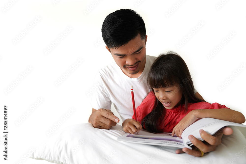 Asian father teaching his daughter's homework Asian father teaching his daughter's homework