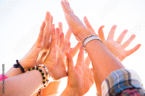 Quadro em tela close up of group of hands in the air with white background - happy and active p