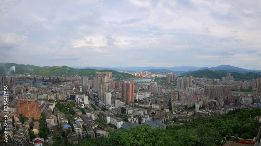 Wide angle pan of a typical cityscape in China. Wide angle pan of a typical cityscape in China.