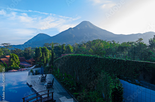 Mount Penanggungan view behind the pool photo