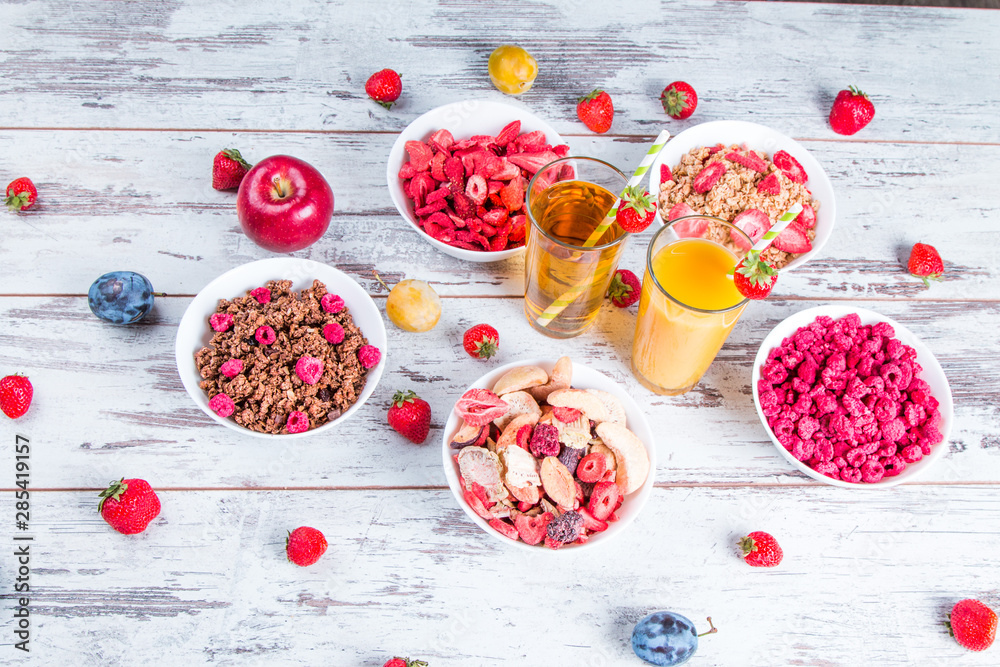Breakfast served with healthy cereals, orange and apple juice, fruits
