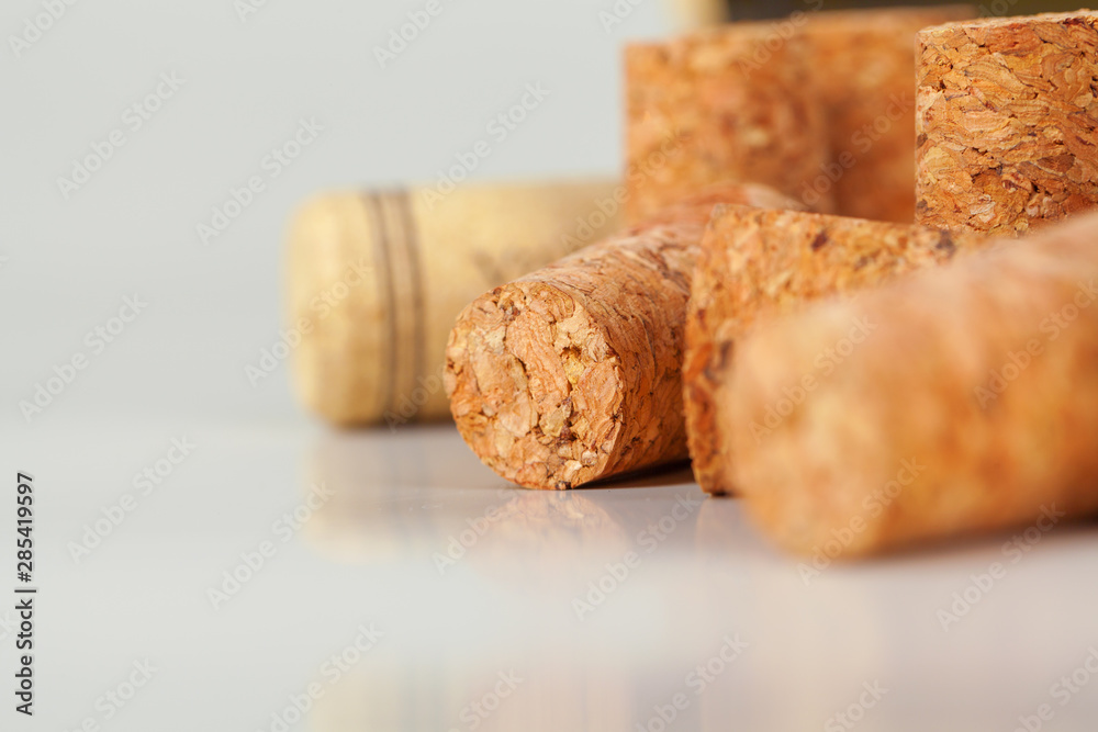 Heap of assorted wine corks on wooden background