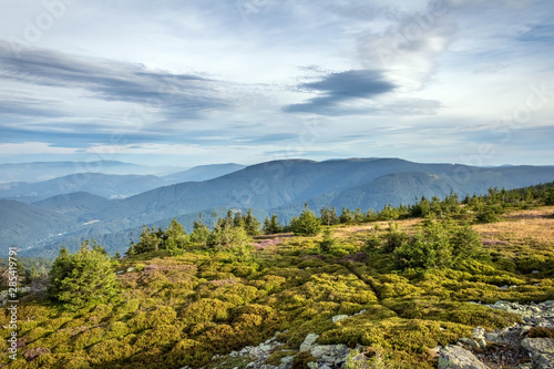 Amazing view from summer mountain ridge under blue sky