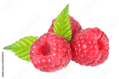 ripe raspberries with green leaf isolated on white background