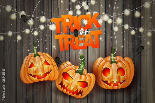 Halloween trick or treat realistic design. Haning pumpkins and lights garland over wooden board background. Vector illustration.