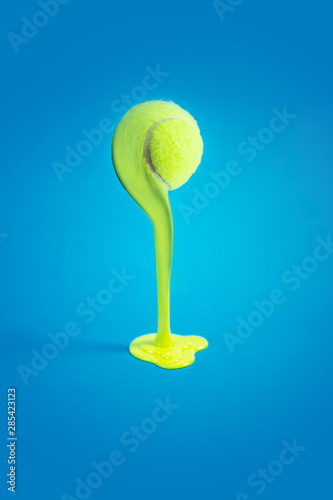 Canvas Print Creative concept photo of tennis ball melting