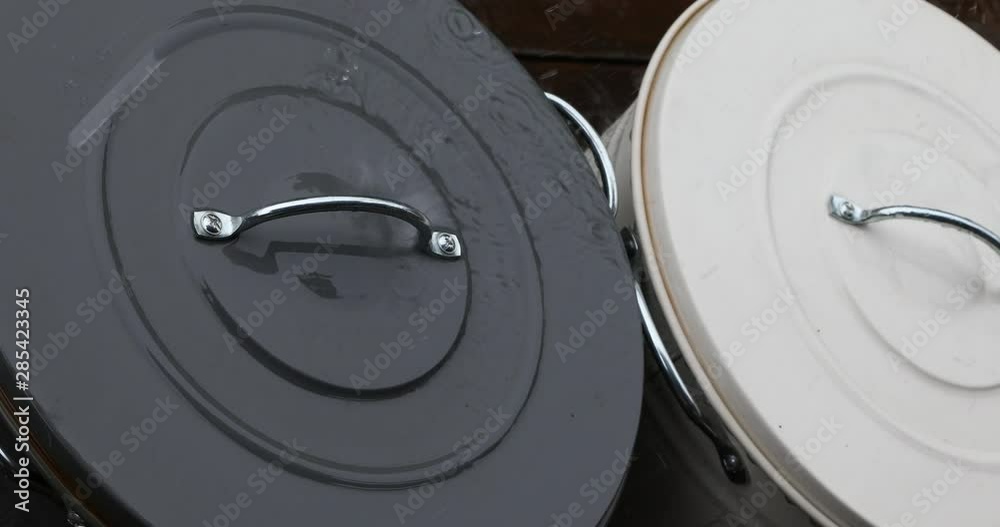 Rain drops over the tin lid