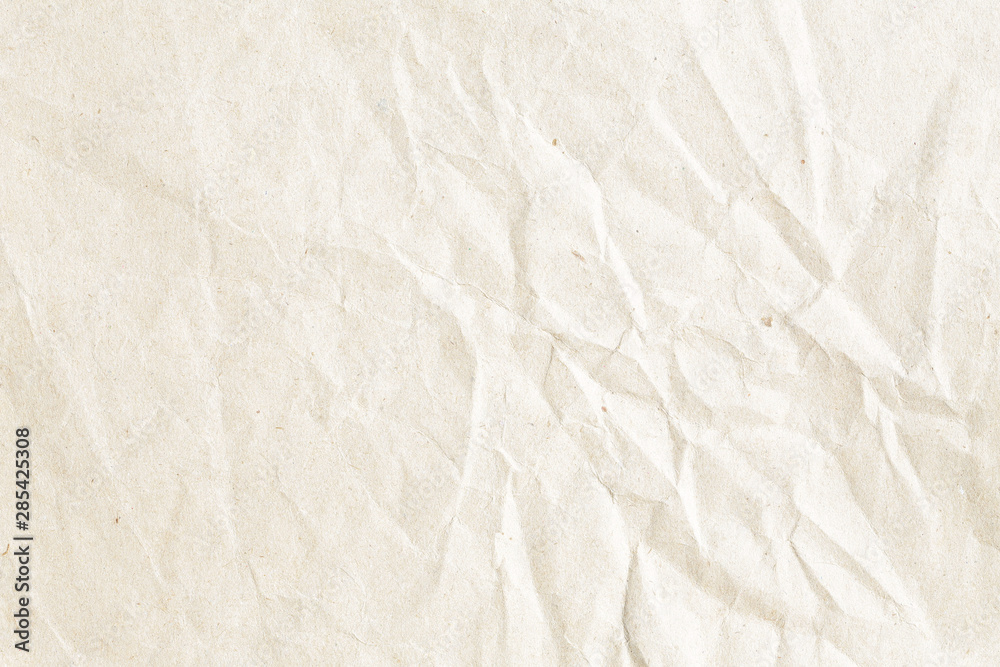 Fototapeta premium Old pale brown crumpled paper background texture