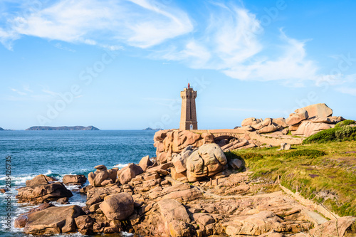 Landscape on the Pink Granite Coast in northern Brittany on the municipality of Perros-Guirec, France, with the Ploumanac'h lighthouse, named Mean Ruz and made of the same pink granite. © olrat