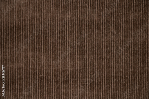 Texture of old, brown velveteen fabric photo