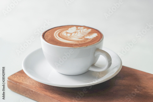 Coffee cup on table in cafe  on wooden