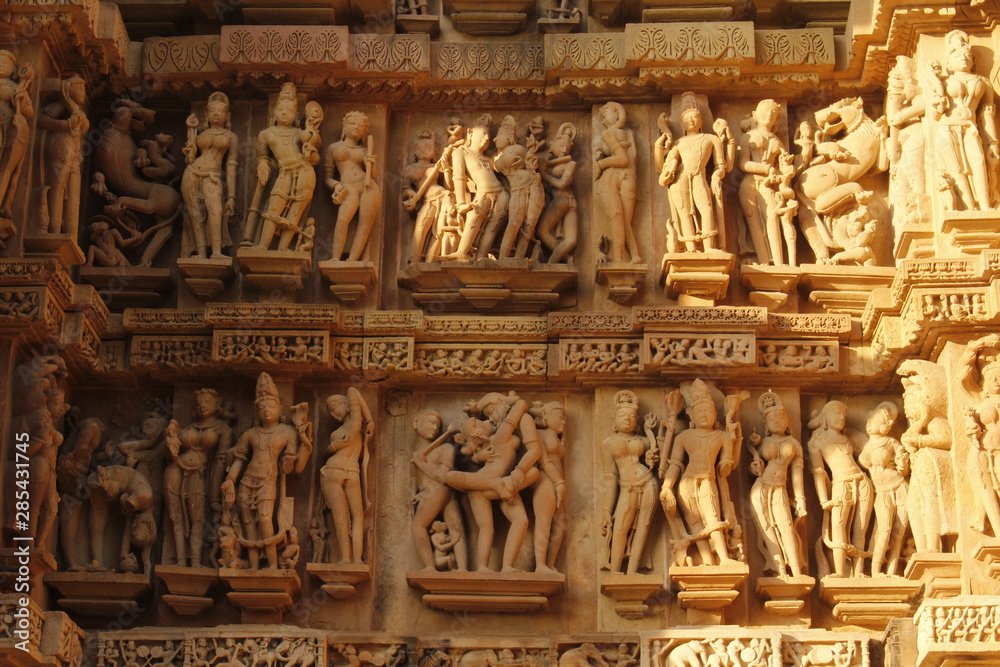 A closeup of beautiful stone carving of Hindu Gods and various human forms at Khajuraho Temple, Madhya Pradesh - A World unesco heritage site