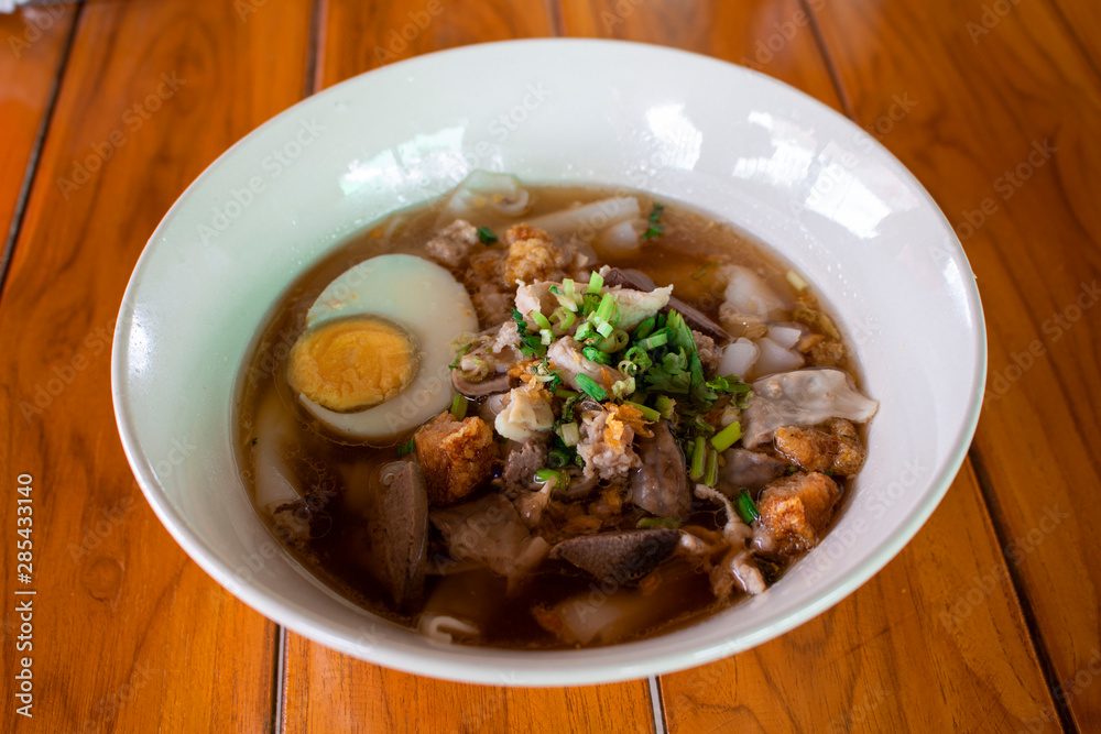 Paste of rice flour in a bowl placed on a wooden table,asian food Paste of rice flour in a bowl placed on a wooden table,asian food