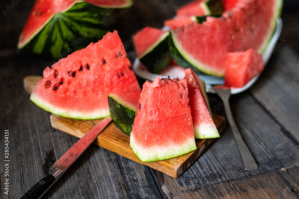 Slices of watermelon on old wooden rustic table
