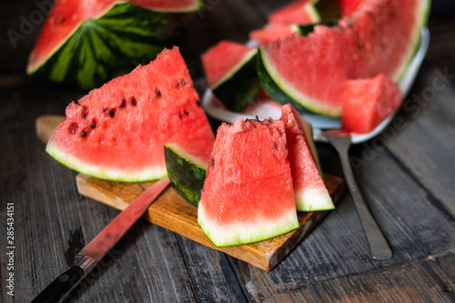 Slices of watermelon on old wooden rustic table