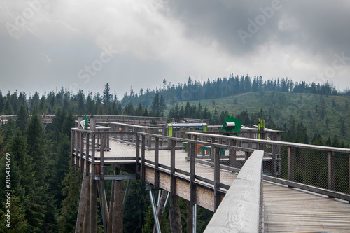 Wooden among the trees with view on Tatra montains, named 