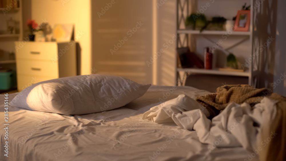 Messy bed, white pillow with blanket lying on bed unmade, oversleeping concept - obrazy, fototapety, plakaty 