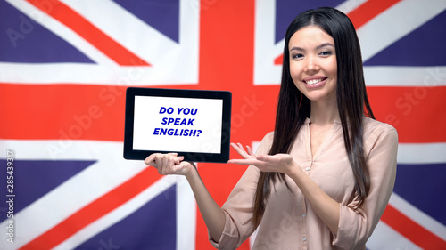 Woman holding tablet with do you speak english phrase, app for learning language