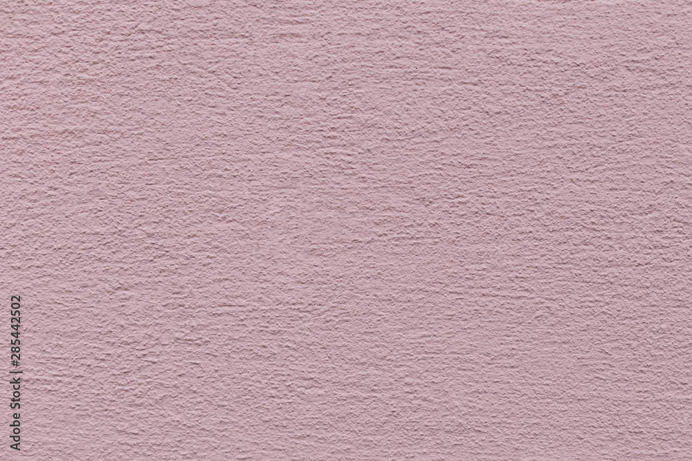 Fototapeta premium Pink pastel background with cement texture.