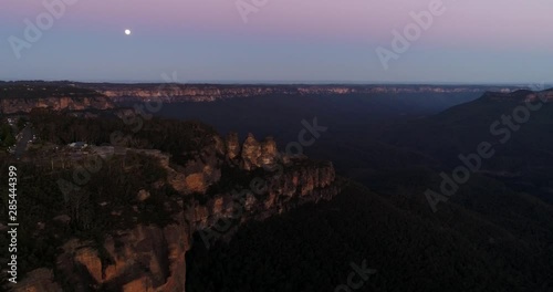 Sunset around Three Sisters rock formation in Blue Mountaisn of Austria off Echo point lookout and Katoomba town. photo