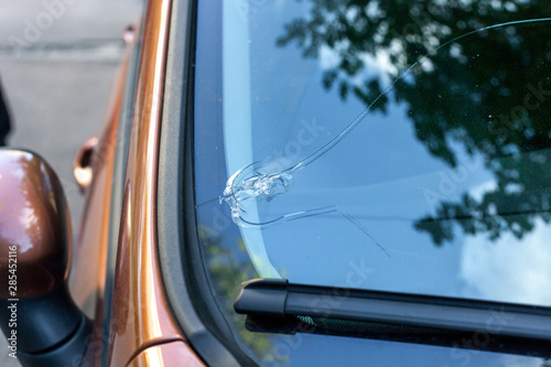 Broken car windshield glass from stone