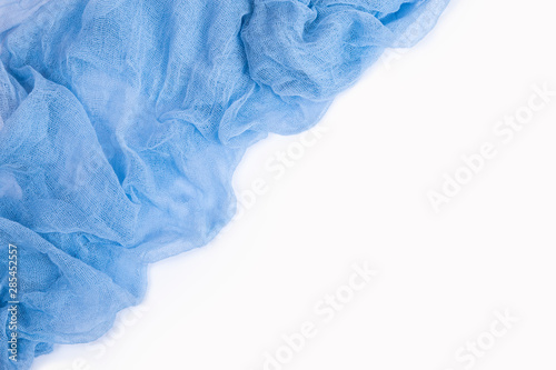 Dark blue gauze fabric isolated on white background. Top view.