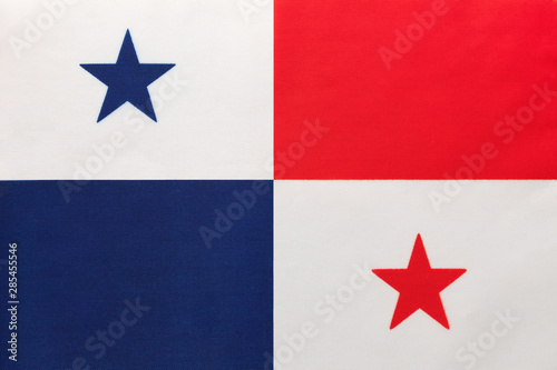 Panama national fabric flag with emblem, textile background. Symbol of international world south america country.