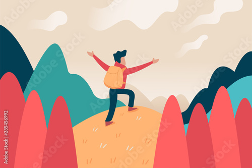 backpacker standing on a mountain and looking at the landscape scene 