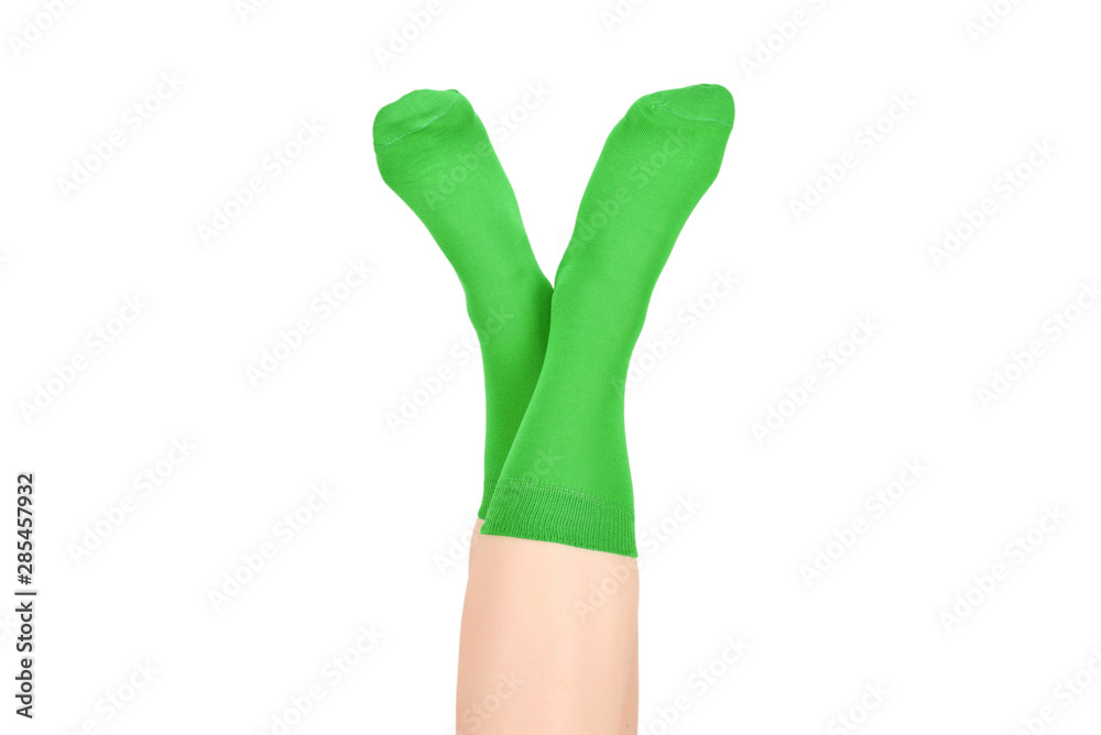 Woman in green socks isolated on white background. Top view. Woman in green socks isolated on white background. Top view.
