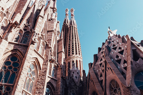 Sagrada Familia building exterior on hot summer day in Barcelona Spain with blue sky photo