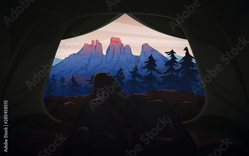 View from the tent to the mountains. Hiking and camping concept. Amazing Foggy landscape. Swiss or Austrian Alps. Background for travel banner or poster.