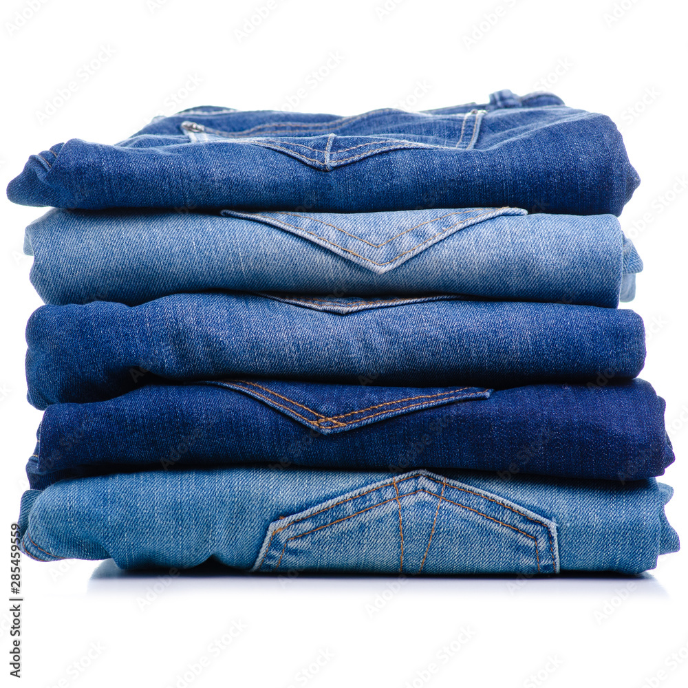 Stack folded jeans on white background isolation Stack folded jeans on white background isolation