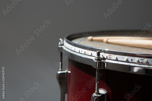 percusions drums with drumsticks on it close-up