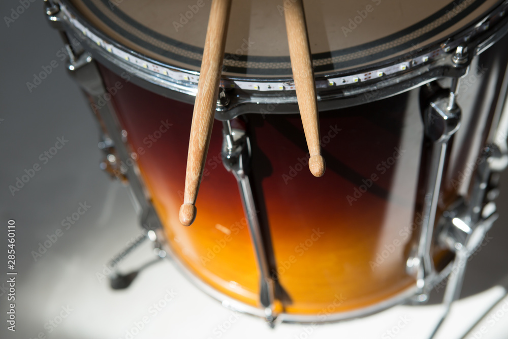 Obraz premium percusions drums with drumsticks on it close-up