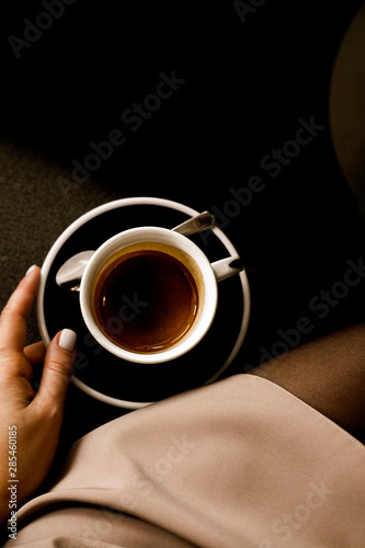 Woman hand holding espresso coffee