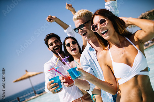 Group of friends having fun on summer vacation. Lifestyle, friendship, travel and holidays concept © NDABCREATIVITY