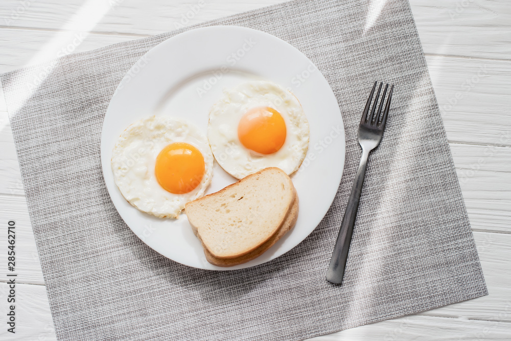 Healthy breakfast with fried eggs on wooden table Healthy breakfast with fried eggs on wooden table