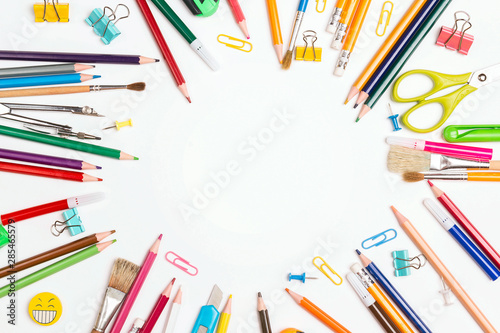 Back to school concept with school supplies and copy space on white background.